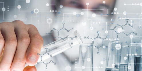 man with flasks in chemicals lab
