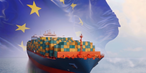 A large container ship featuring the European Union flag, symbolizing the EU's CBAM policy